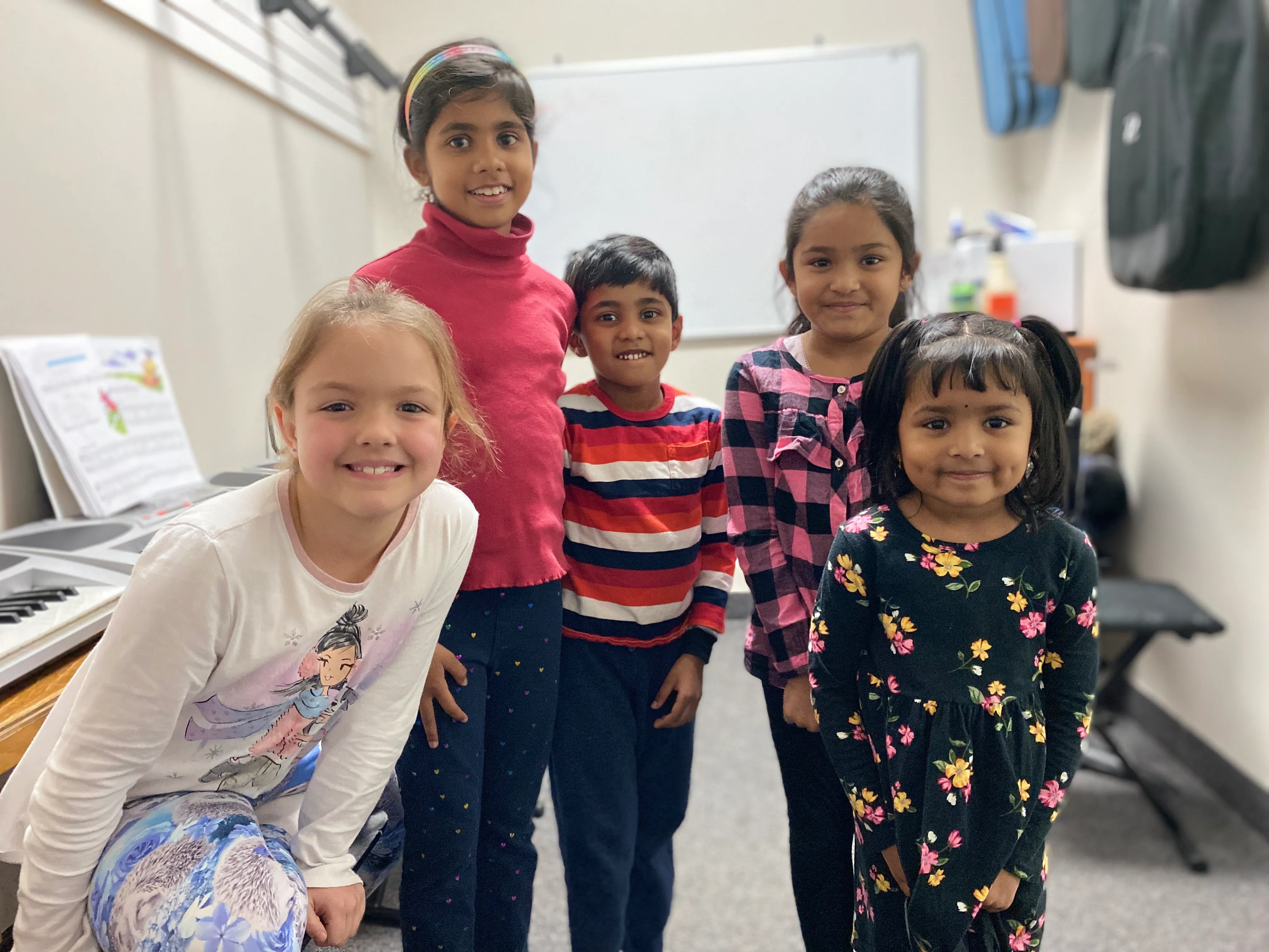 Children in a group music class at SYNERGY
