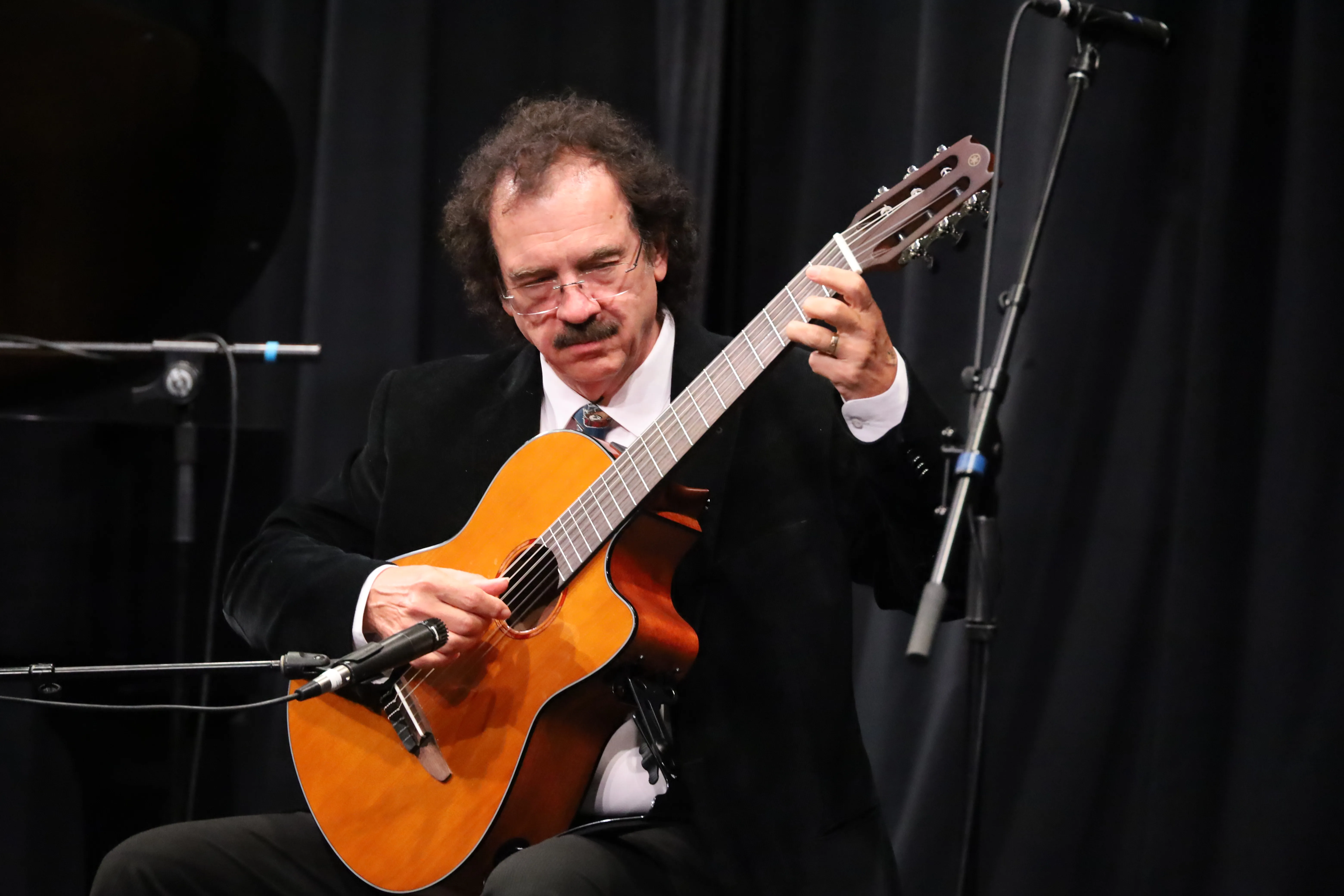 Adult taking a music lesson at SYNERGY Brampton