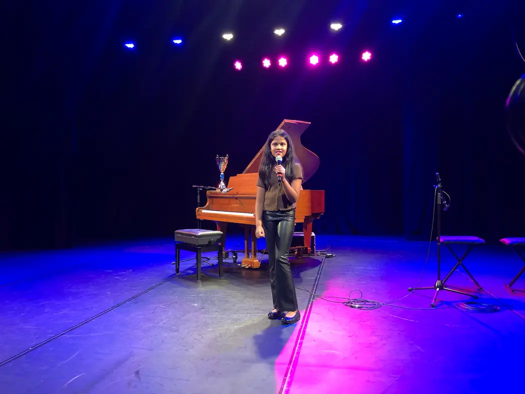 Student singing at recital at Synergy in Brampton