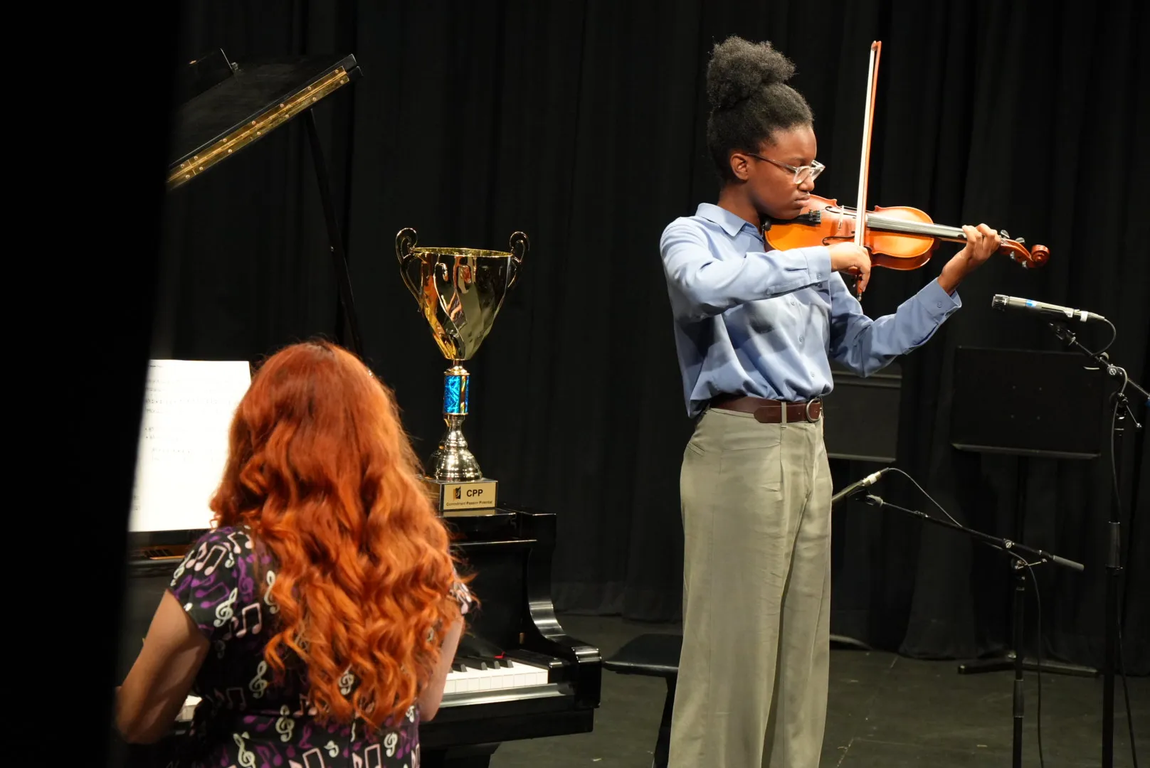 Violin student performing at Cyril Clark Theatre